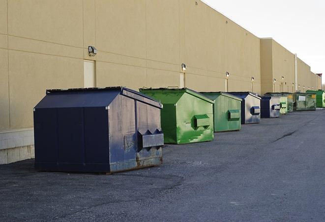 a collection of bright and vibrant dumpsters in a construction zone in Aberdeen